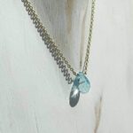 Collier topaze bleue doré